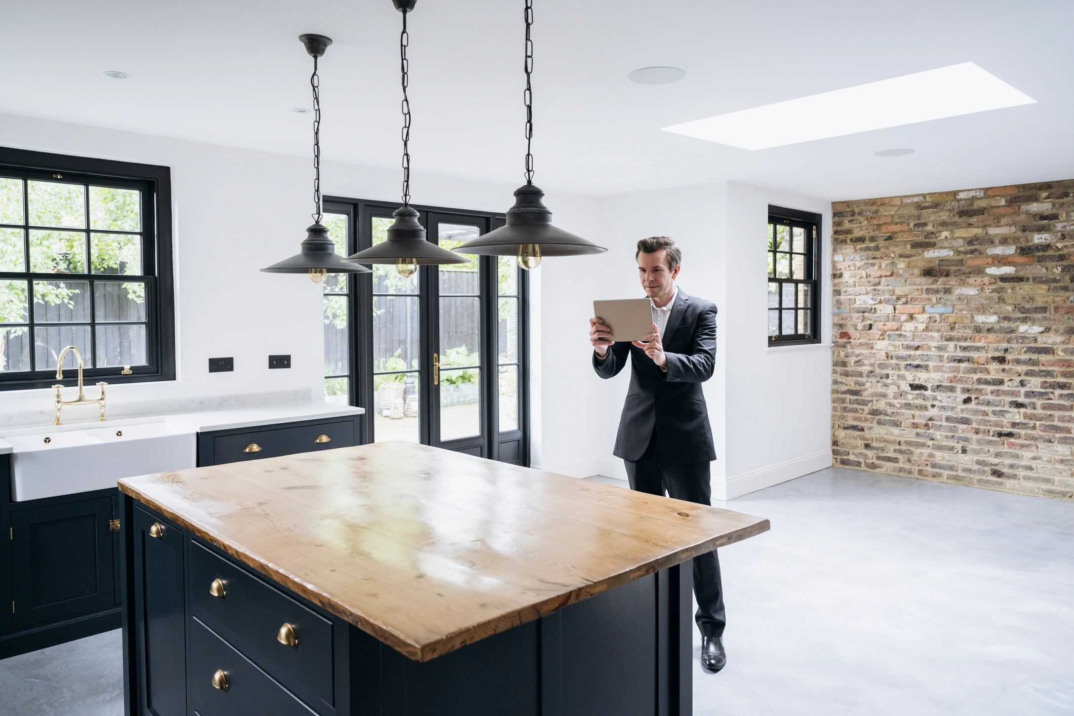 Lettings agent documenting a property with a tablet during an inspection