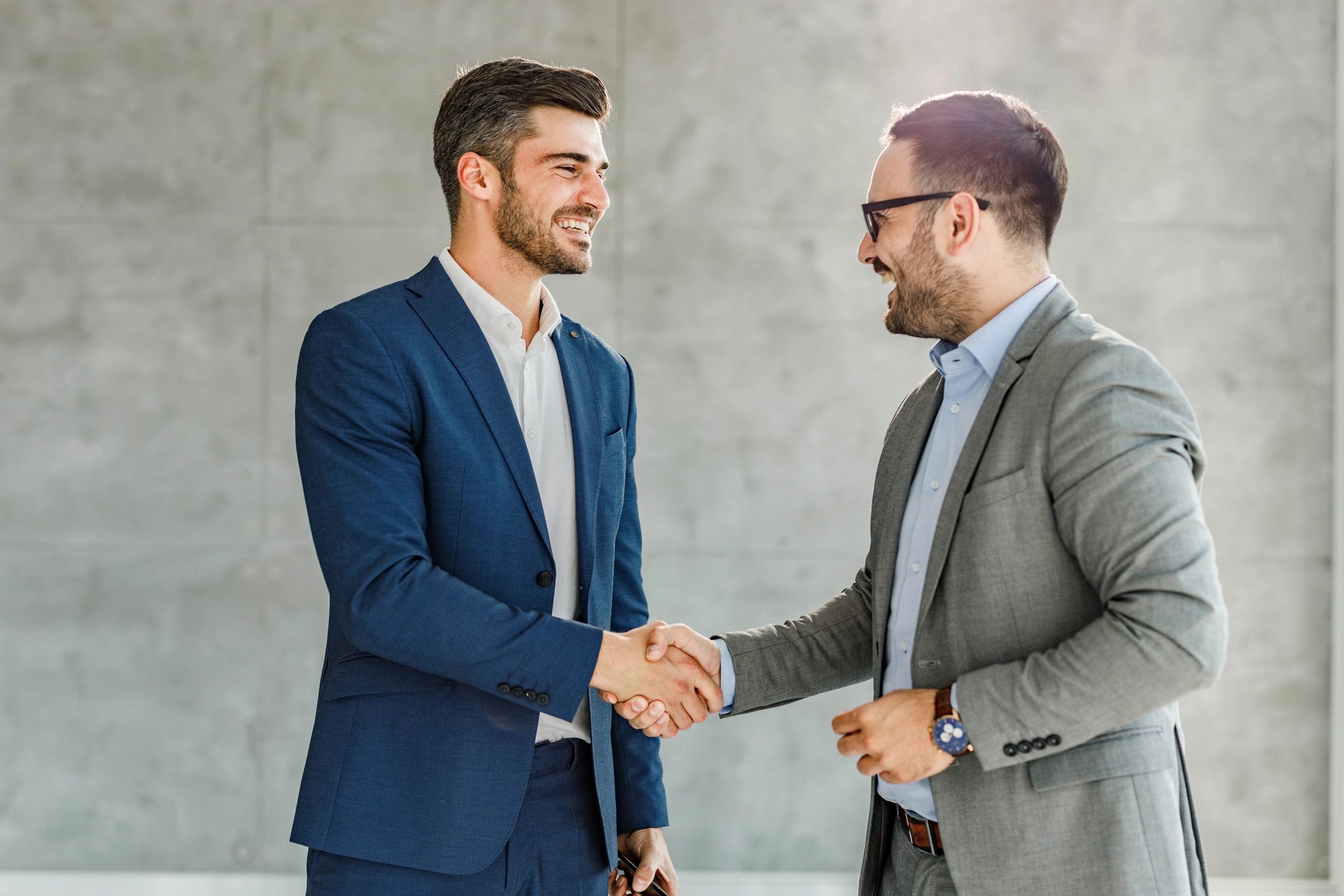 Property professional shaking hands with a client