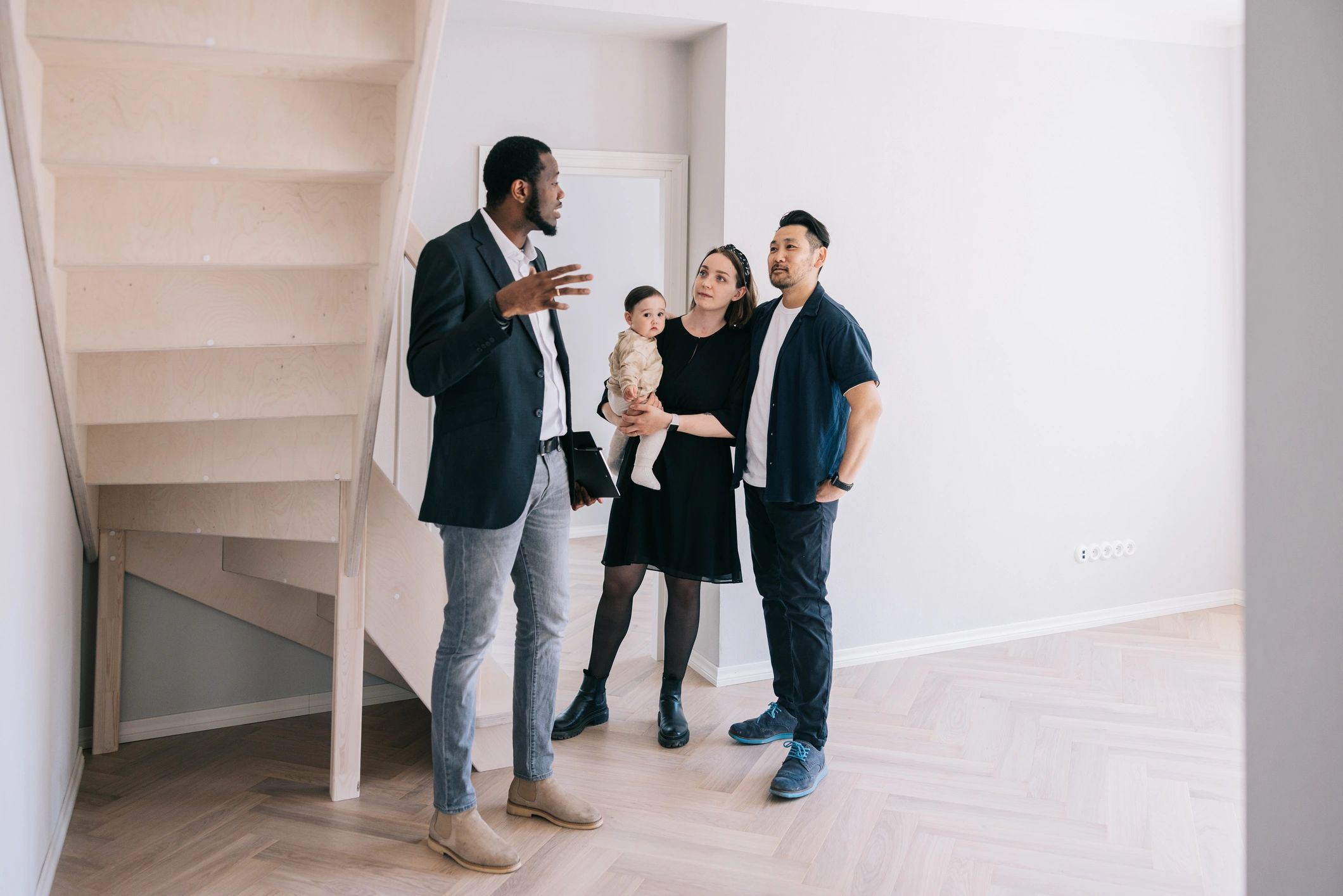 Agent showing a home to prospective tenants