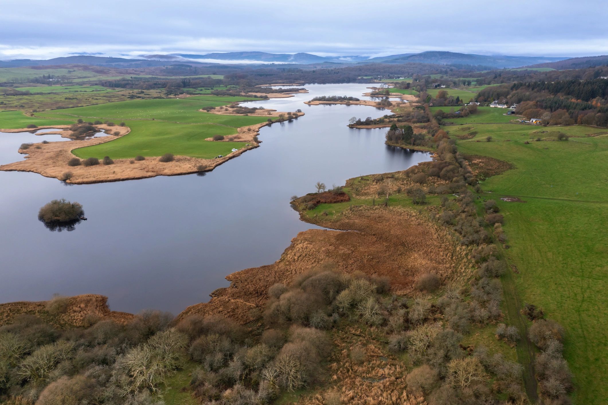 Scottish loch in rural landscape